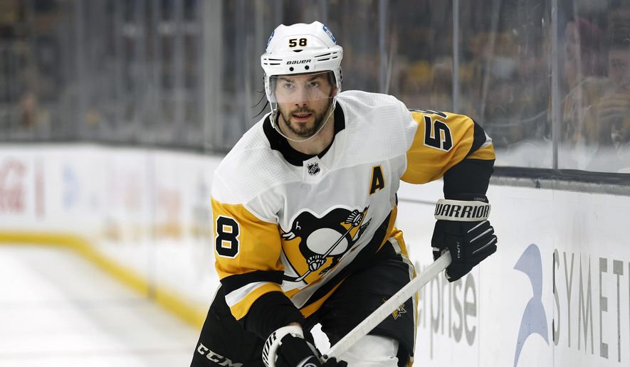 Pittsburgh Penguins&#x27; Kris Letang plays during the third period of an NHL hockey game against the Boston Bruins Saturday, April 16, 2022, in Boston. Penguins defenseman Kris Letang is out indefinitely after suffering a stroke. General manager Ron Hextall announced Tuesday, Nov. 29, that the 35-year-old Letang had the stroke Monday. (AP Photo/Winslow Townson, File) **FILE**