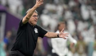 Mexico&#39;s head coach Gerardo Martino gestures during the World Cup group C soccer match between Saudi Arabia and Mexico, at the Lusail Stadium in Lusail, Qatar, Wednesday, Nov. 30, 2022. (AP Photo/Moises Castillo)