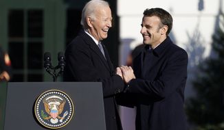 President Joe Biden welcomes French President Emmanuel Macron during a State Arrival Ceremony on the South Lawn of the White House in Washington, Thursday, Dec. 1, 2022. (AP Photo/Patrick Semansky)