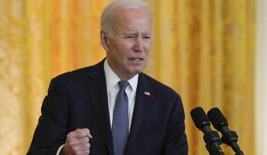 President Joe Biden speaks about Russian President Vladimir Putin and the war in Ukraine in response to a question during a news conference with French President Emmanuel Macron in the East Room of the White House in Washington, Thursday, Dec. 1, 2022. (AP Photo/Susan Walsh)