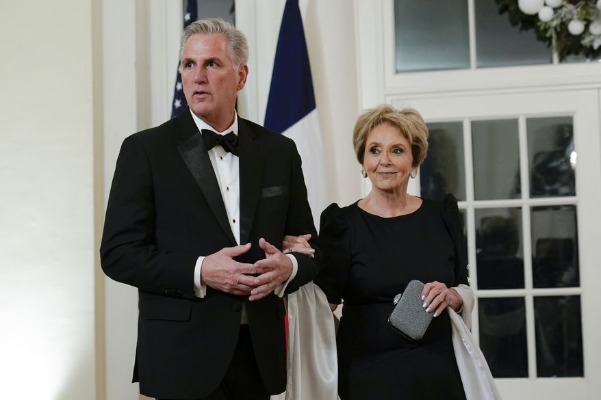 House Minority Leader Kevin McCarthy of Calif., and his mother Roberta McCarthy arrive for the State Dinner with President Joe Biden and French President Emmanuel Macron at the White House in Washington, Thursday, Dec. 1, 2022. (AP Photo/Susan Walsh)