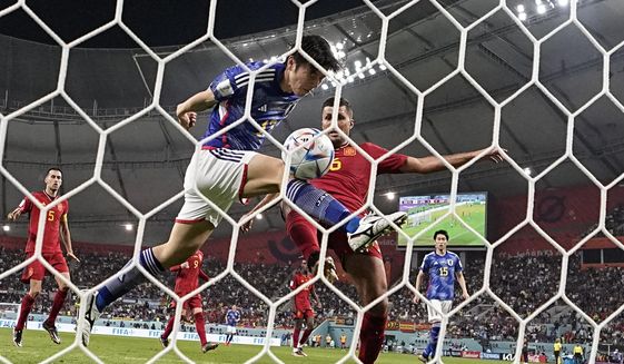 Japan&#39;s Ao Tanaka scores his side&#39;s second goal during the World Cup group E soccer match between Japan and Spain, at the Khalifa International Stadium in Doha, Qatar, Thursday, Dec. 1, 2022. (AP Photo/Darko Vojinovic)