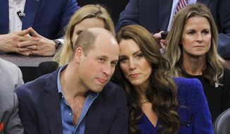 Britain&#39;s Prince William and Kate, Princess of Wales, watch the NBA basketball game between the Boston Celtics and the Miami Heat on Wednesday, Nov. 30, 2022, in Boston. (Brian Snyder/Pool Photo via AP)