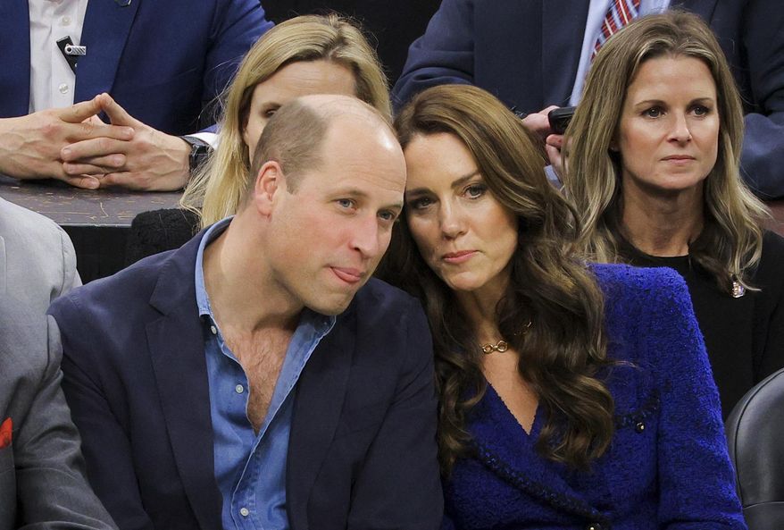Britain&#x27;s Prince William and Kate, Princess of Wales, watch the NBA basketball game between the Boston Celtics and the Miami Heat on Wednesday, Nov. 30, 2022, in Boston. (Brian Snyder/Pool Photo via AP)