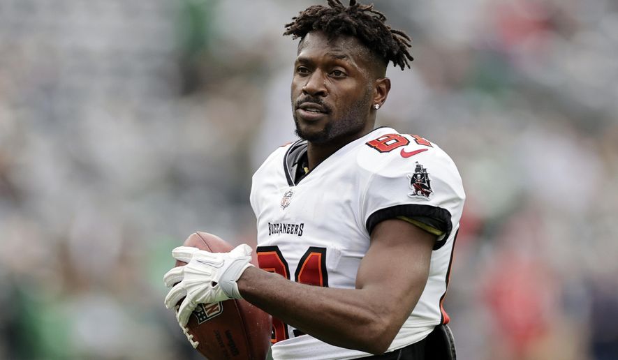 FILE - Tampa Bay Buccaneers wide receiver Antonio Brown (81) walks on the field during an NFL football game against the New York Jets, Sunday, Jan. 2, 2022, in East Rutherford, N.J. Former NFL wide receiver Antonio Brown is wanted on a battery charge stemming from a domestic incident, Tampa police said Thursday, Dec. 1, 2022. (AP Photo/Adam Hunger, File)