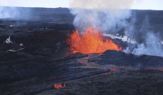 This aerial image courtesy of Hawaii Dept. of Land and Natural Resources shows lava flows on Mauna Loa, the world&#39;s largest active volcano, on Wednesday, Nov. 30, 2022, near Hilo, Hawaii. (Hawaii Dept. of Land and Natural Resources via AP)