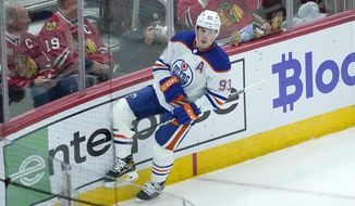 Edmonton Oilers&#39; Ryan Nugent-Hopkins celebrates his goal during the second period of an NHL hockey game against the Chicago Blackhawks Wednesday, Nov. 30, 2022, in Chicago. (AP Photo/Charles Rex Arbogast)