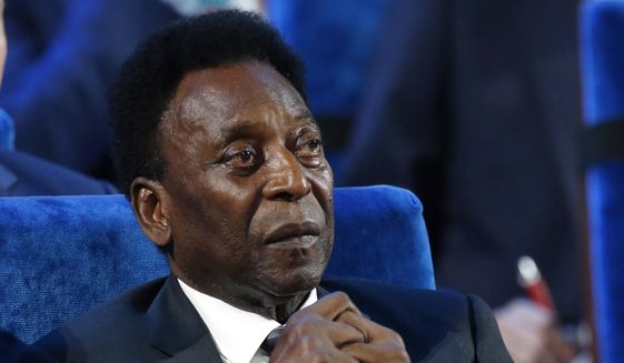 Brazilian Pele attends the 2018 soccer World Cup draw at the Kremlin in Moscow, Dec. 1, 2017. Brazilian soccer great Pelé was hospitalized in Sao Paulo to regulate the medication in his fight against a colon tumor, his daughter said on Wednesday, Nov. 30, 2022. Kely Nascimento added that there was “no emergency” concerning her 82-year-old father&#39;s health. (AP Photo/Alexander Zemlianichenko, File)