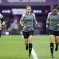 Referee Stephanie Frappart, center, assistants referee Neuza Back, left, and Karen Diaz warm up prior to the World Cup group E soccer match between Costa Rica and Germany at the Al Bayt Stadium in Al Khor , Qatar, Thursday, Dec. 1, 2022. (AP Photo/Hassan Ammar)