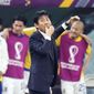 Japan&#39;s head coach Hajime Moriyasu whistles during the World Cup group E soccer match between Japan and Spain, at the Khalifa International Stadium in Doha, Qatar, Thursday, Dec. 1, 2022. (AP Photo/Aijaz Rahi)