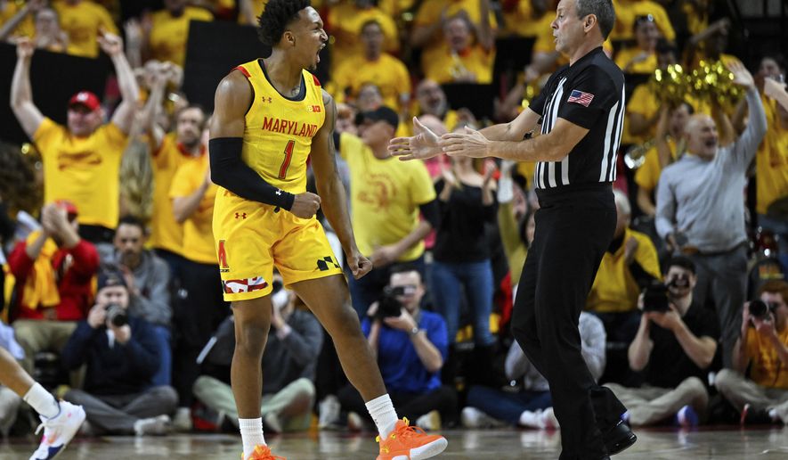 Maryland guard Jahmir Young (1) reacts after making a 3-point basket during the first half of an NCAA college basketball game against Illinois, Friday, Dec. 2, 2022, in College Park, Md. (AP Photo/Terrance Williams)