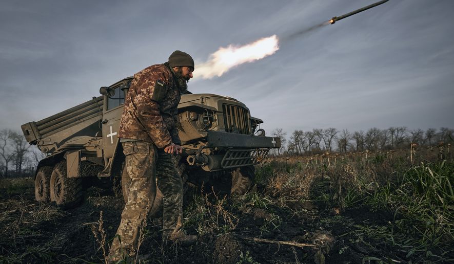 Ukrainian military&#39;s Grad multiple rocket launcher fires rockets at Russian positions in the frontline near Bakhmut, Donetsk region, Ukraine, Thursday, Nov. 24, 2022. (AP Photo/LIBKOS)