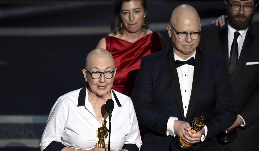 Julia Reichert, left, and Steven Bognar accept the award for best documentary feature for &quot;American Factory&quot; at the Oscars in Los Angeles on Feb. 9, 2020.  Reichert, the Oscar-winning documentary filmmaker whose films explored themes of race, class and gender, often in the Midwest, died Thursday in Ohio from cancer, her family said Friday through a representative. She was 76. (AP Photo/Chris Pizzello, File)
