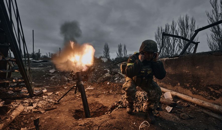 A Ukrainian soldier fires a mortar at Russian positions in Bakhmut, Donetsk region, Ukraine, Thursday, Nov. 10, 2022.  A top adviser to Ukraine&#39;s president has cited military chiefs as saying 10,000 to 13,000 Ukrainian soldiers have been killed in the country&#39;s nine-month struggle against Russia&#39;s invasion, a rare comment on such figures and far below estimates of Ukrainian casualties from Western leaders. Late Thursday, Dec. 1, 2022, Mykhailo Podolyak, a top adviser to Ukrainian President Volodymyr Zelenskyy, relayed new figures about Ukrainian soldiers killed in battle, while noting that the number of injured troops was higher and civilian casualty counts were “significant.” (AP Photo/Libkos, File)