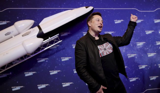 SpaceX owner and Tesla CEO Elon Musk arrives on the red carpet for the Axel Springer media award, in Berlin, Germany on Dec. 1, 2020. (Hannibal Hanschke/Pool via AP, File)