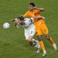 Walker Zimmerman of the United States, left, fights for the ballwith Cody Gakpo of the Netherlands during the World Cup round of 16 soccer match between the Netherlands and the United States, at the Khalifa International Stadium in Doha, Qatar, Saturday, Dec. 3, 2022. (AP Photo/Ricardo Mazalan)