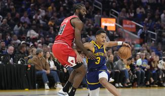 Golden State Warriors guard Jordan Poole (3) changes direction while defended by Chicago Bulls forward Patrick Williams (44) during the first half of an NBA basketball game in San Francisco, Friday, Dec. 2, 2022. (AP Photo/Godofredo A. Vásquez)
