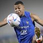 France&#x27;s Kylian Mbappe controls the ball during a training session at the Jassim Bin Hamad stadium in Doha, Qatar, Friday, Dec. 2, 2022. France will play in the World Cup against Poland on Dec. 4. (AP Photo/Christophe Ena)