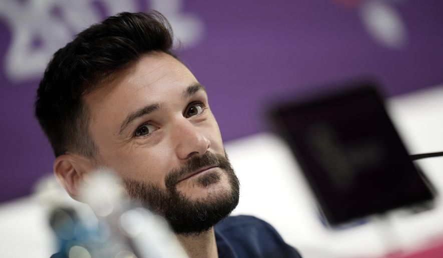 France&#39;s goalkeeper Hugo Lloris answers a reporter during a press conference in Doha, Qatar, Saturday, Dec. 3, 2022, on the eve of the World Cup soccer match between France and Poland. (AP Photo/Christophe Ena)