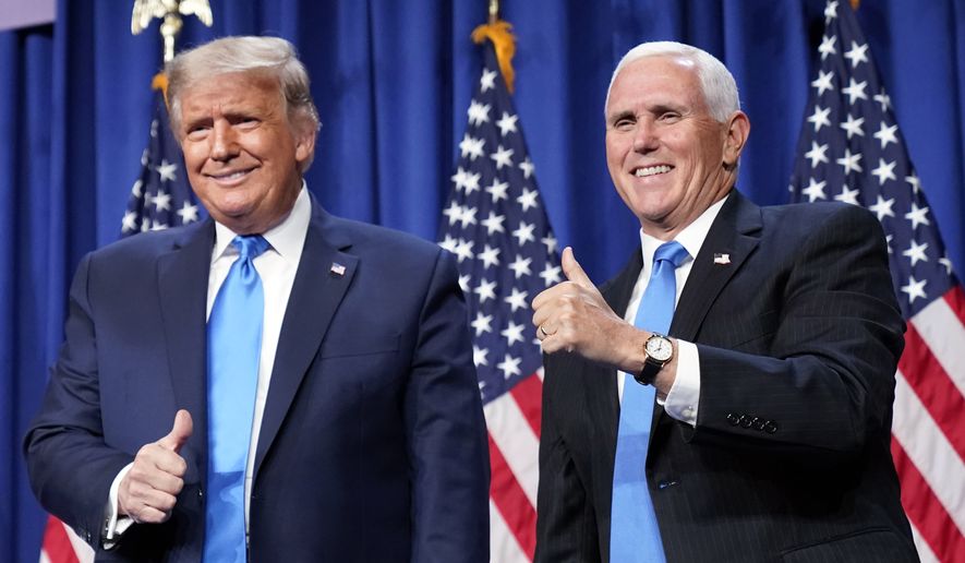 President Donald Trump and Vice President Mike Pence stand on stage during the first day of the 2020 Republican National Convention in Charlotte, N.C., Monday, Aug. 24, 2020. (AP Photo/Andrew Harnik)