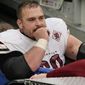 Washington Commanders&#39; Tyler Larsen is carted off the field during the second half of an NFL football game against the New York Giants, Sunday, Dec. 4, 2022, in East Rutherford, N.J. (AP Photo/John Minchillo)