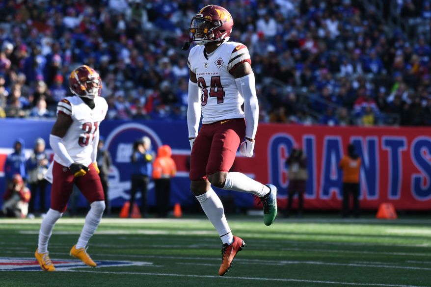 Washington Commanders cornerback Christian Holmes (34) celebrating a big play during the 1st Half of an NFL game against the New York Giants at MetLife Stadium in E. Rutherford, NJ, December 4, 2022. (Photo by Billy Sabatini)