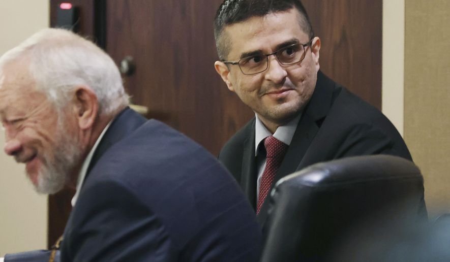 FILE - Capital murder defendant and former U.S. Border Patrol Juan David Ortiz looks around the courtroom before the start of the first day of the trial before Webb County State District Court Judge Oscar J. Hale, on Nov. 28, 2022. Jurors in Ortiz&#39;s capital murder trial have heard him confess in a taped interview in early December 2022 to killing four sex workers in South Texas. (Jerry Lara/The San Antonio Express-News via AP, File)