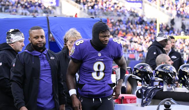 Baltimore Ravens quarterback Lamar Jackson (8) leaves the injury tent and heads toward the locker room, during the first half of an NFL football game against the Denver Broncos, Sunday, Dec. 4, 2022, in Baltimore. (AP Photo/Nick Wass) **FILE**