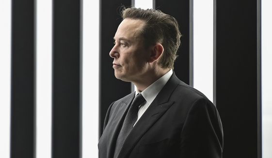 Elon Musk, Tesla CEO, attends the opening of the Tesla factory Berlin Brandenburg in Gruenheide, Germany, March 22, 2022. Musk said during a presentation Wednesday, Dec. 1, 2022, that his Neuralink company is seeking permission to test its brain implant in people soon. Musk’s Neuralink is one of many groups working on linking brains to computers, efforts aimed at helping treat brain disorders, overcoming brain injuries and other applications. (Patrick Pleul/Pool via AP, File)