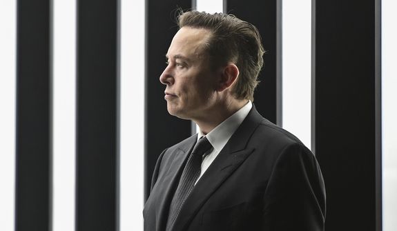 FILE - Elon Musk, Tesla CEO, attends the opening of the Tesla factory Berlin Brandenburg in Gruenheide, Germany, March 22, 2022. Musk said during a presentation Wednesday, Dec. 1, 2022, that his Neuralink company is seeking permission to test its brain implant in people soon. Musk’s Neuralink is one of many groups working on linking brains to computers, efforts aimed at helping treat brain disorders, overcoming brain injuries and other applications. (Patrick Pleul/Pool via AP, File)
