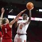Maryland&#39;s Shyanne Sellers shoots as Nebraska&#39;s Jaz Shelley defends in the first half of an NCAA college basketball game, Sunday, Dec. 4, 2022, in College Park, Md. (AP Photo/Gail Burton)