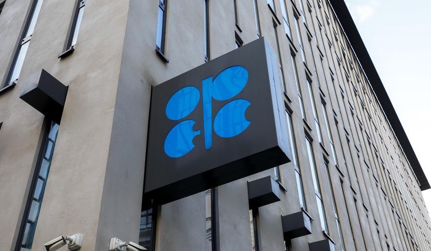 FILE - The logo of the Organization of the Petroleoum Exporting Countries (OPEC) is seen outside of OPEC&#39;s headquarters in Vienna, Austria, on March 3, 2022.  The Saudi-led OPEC oil cartel and allied producing countries, including Russia, are scheduled to decide how much oil to supply to the global economy amid weakening demand in China and uncertainty about the impact of new Western sanctions against Russia that could take significant amounts of oil off the market.(AP Photo/Lisa Leutner, File)
