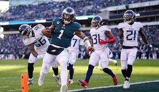 Philadelphia Eagles&#x27; Jalen Hurts scores a touchdown during the first half of an NFL football game against the Tennessee Titans, Sunday, Dec. 4, 2022, in Philadelphia. (AP Photo/Matt Rourke)