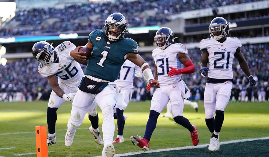 Philadelphia Eagles&#39; Jalen Hurts scores a touchdown during the first half of an NFL football game against the Tennessee Titans, Sunday, Dec. 4, 2022, in Philadelphia. (AP Photo/Matt Rourke)