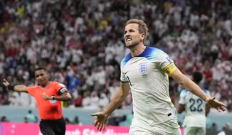 England&#x27;s Harry Kane celebrates scoring his side&#x27;s second goal during the World Cup round of 16 soccer match between England and Senegal, at the Al Bayt Stadium in Al Khor, Qatar, Sunday, Dec. 4, 2022. (AP Photo/Frank Augstein)