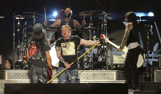 Guns N&#39; Roses&#39; Axl Rose, center, Slash, left, and Richard Fortus perform on the first weekend of the Austin City Limits Music Festival at Zilker Park in Austin, Texas, on Friday, Oct. 4, 2019. (Photo by Jack Plunkett/Invision/AP) **FILE**