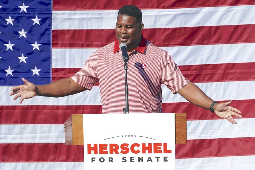 Republican candidate for U.S. Senate Herschel Walker speaks during a campaign stop in Cumming, Ga., Thursday, Oct. 27, 2022. (AP Photo/John Bazemore)