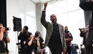 U.S. Sen. Raphael Warnock, D-Ga., waves to supporters as arrives to speak at a campaign rally at Georgia Tech Monday, Dec. 5, 2022, in Atlanta. Warnock is in a runoff with Republican Herschel Walker. (AP Photo/John Bazemore)