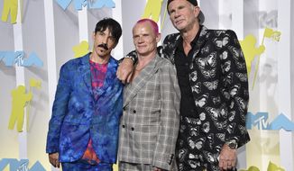 Anthony Kiedis, from left, Flea and Chad Smith, of Red Hot Chili Peppers, appear at the MTV Video Music Awards on Aug. 28, 2022, in Newark, N.J. Live Nation said Monday the band  will perform at a set of stadium shows and festivals across North America and Europe beginning March 29. (Photo by Evan Agostini/Invision/AP, File)