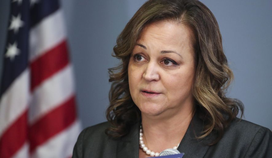 Mary O'Connor addresses reporters during a news conference at the Tampa Police Department headquarters, Feb. 8, 2022, in Tampa, Fla. O'Connor has been placed on leave after a video emerged of her flashing her badge from the passenger seat of a golf cart to get out of a traffic ticket. Tampa Mayor Jane Castor placed Chief O’Connor on administrative leave Friday, Dec. 2, 2022 pending an investigation of the Nov. 12 traffic stop. (Dirk Shadd/Tampa Bay Times via AP)