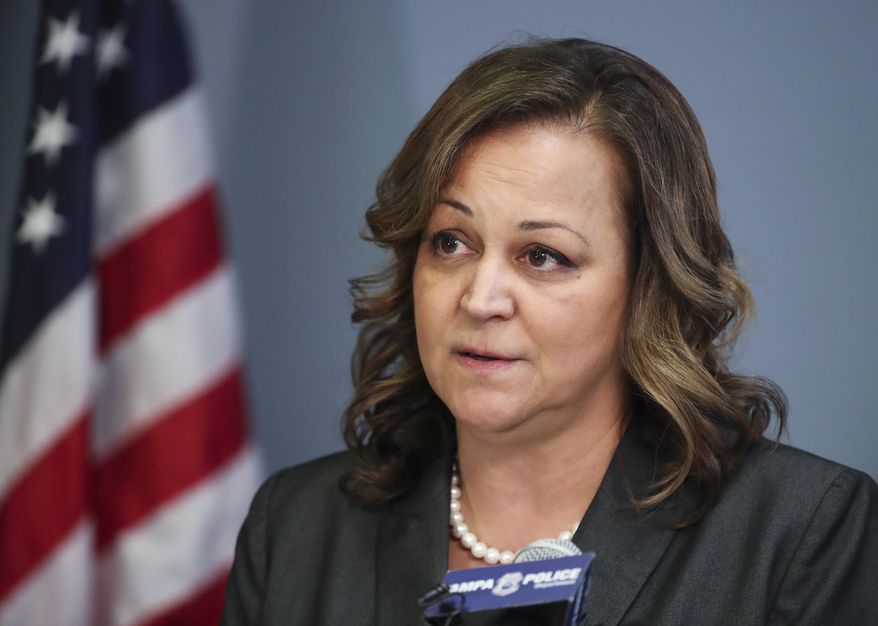 Mary O'Connor addresses reporters during a news conference at the Tampa Police Department headquarters, Feb. 8, 2022, in Tampa, Fla. O'Connor has been placed on leave after a video emerged of her flashing her badge from the passenger seat of a golf cart to get out of a traffic ticket. Tampa Mayor Jane Castor placed Chief O’Connor on administrative leave Friday, Dec. 2, 2022 pending an investigation of the Nov. 12 traffic stop. (Dirk Shadd/Tampa Bay Times via AP)