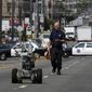 A police officer uses a robot to investigate a bomb threat in San Francisco, on July 25, 2008. The liberal city of San Francisco became the unlikely proponent of weaponized police robots on Tuesday, Nov. 29, 2022, after supervisors approved limited use of the remote-controlled devices, addressing head-on an evolving technology that has become more widely available even if it is rarely deployed to confront suspects. (Michael Macor/San Francisco Chronicle via AP)