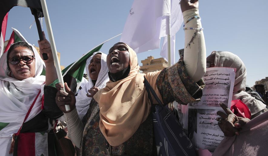 FILE - Sudanese demonstrators attend a rally to demand the return to civilian rule a year after a military coup, in Khartoum, Sudan, Nov. 17, 2022. Sudan’s ruling generals and the main pro-democracy group signed a framework deal until elections on Monday, Dec. 5, 2022, but key dissenters have stayed out of the agreement. The deal pledges to establish a new, civilian-led transitional government to guide the country to elections and offers a path forward in the wake of Sudan’s stalled transition to democracy following the October 2021 coup. (AP Photo/Marwan Ali, File)