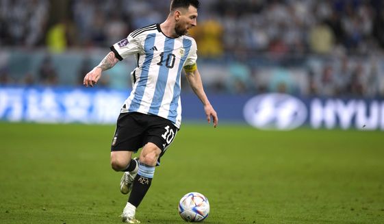 Argentina&#39;s Lionel Messi dribbles the ball during the World Cup round of 16 soccer match between Argentina and Australia at the Ahmad Bin Ali Stadium in Doha, Qatar, Saturday, Dec. 3, 2022. (AP Photo/Frank Augstein)