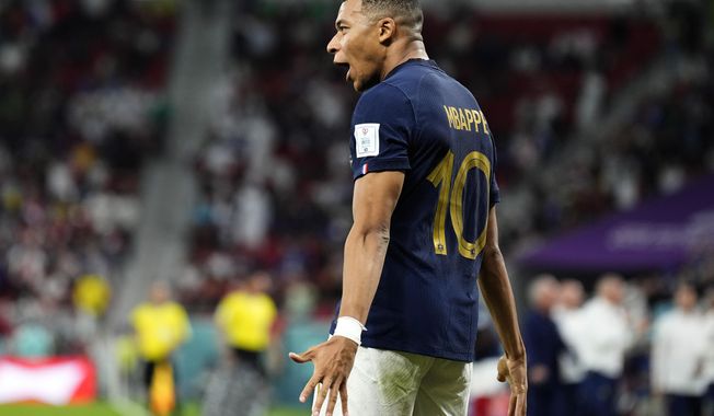 France&#x27;s Kylian Mbappe celebrates scoring his side&#x27;s third goal during the World Cup round of 16 soccer match between France and Poland, at the Al Thumama Stadium in Doha, Qatar, Sunday, Dec. 4, 2022. (AP Photo/Martin Meissner)