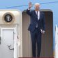 President Joe Biden waves as he boards Air Force One, Tuesday, Dec. 6, 2022, at Andrews Air Force Base, Md. Biden is traveling to Arizona to visit the building site for a new computer chip plant and speak about his economic agenda.(AP Photo/Luis M. Alvarez)