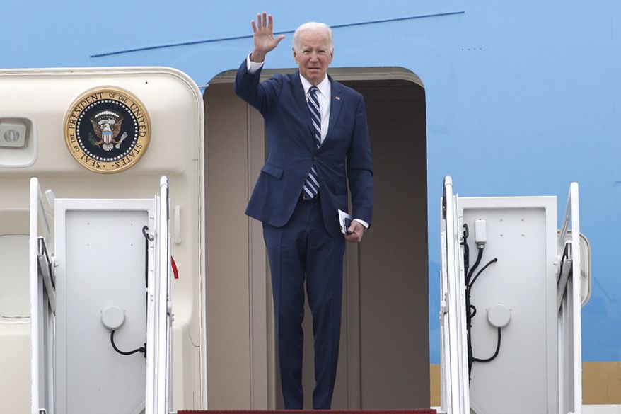 President Joe Biden waves as he boards Air Force One, Tuesday, Dec. 6, 2022, at Andrews Air Force Base, Md. Biden is traveling to Arizona to visit the building site for a new computer chip plant and speak about his economic agenda.(AP Photo/Luis M. Alvarez)