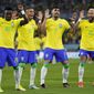 Brazil&#39;s Neymar, from right, celebrates with team mates Lucas Paqueta, Raphinha and Vinicius Junior after scoring his side&#39;s second goal during the World Cup round of 16 soccer match between Brazil and South Korea, at the Stadium 974 in Doha, Qatar, Monday, Dec. 5, 2022. (AP Photo/Manu Fernandez)