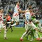 Croatian players celebrate after deafeating Japan during the World Cup round of 16 soccer match between Japan and Croatia at the Al Janoub Stadium in Al Wakrah, Qatar, Monday, Dec. 5, 2022. (AP Photo/Francisco Seco)