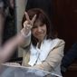 Argentine Vice President Cristina Fernandez greets supporters as she leaves her home in Buenos Aires, Argentina, Aug. 23, 2022. Federal court judges are preparing on Tuesday, Dec. 6, 2022, to announce their verdict in the corruption trial of Fernandez who is accused of running a criminal organization that fraudulently directed about $1 billion in public works projects to a construction magnate closely tied to her family. (AP Photo/Rodrigo Abd, File)